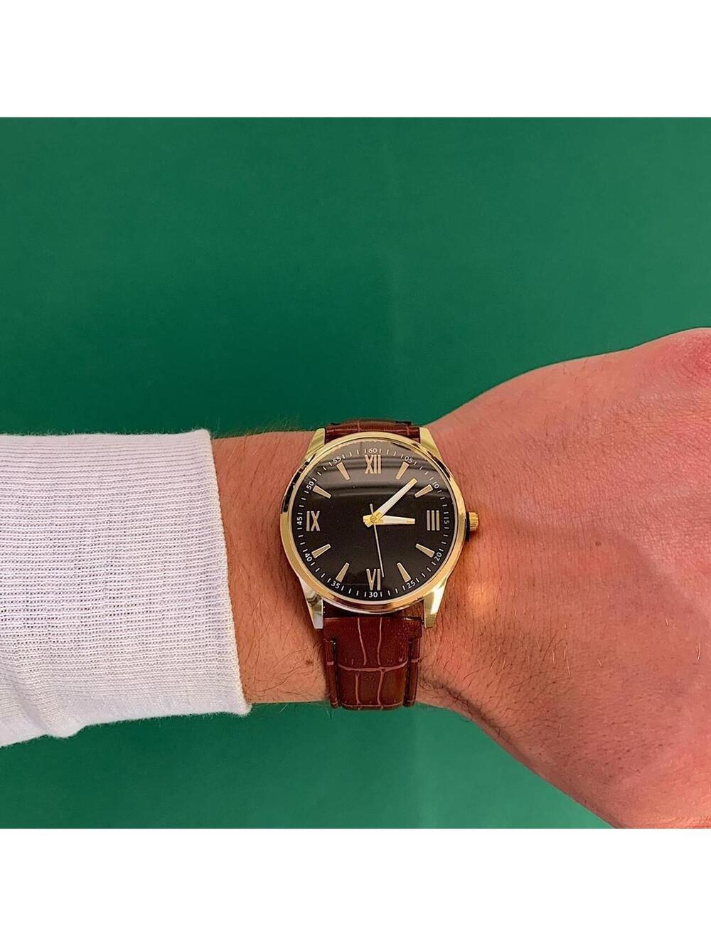 Minimalistic Black essential vintage style gold and leather style band watch. 9